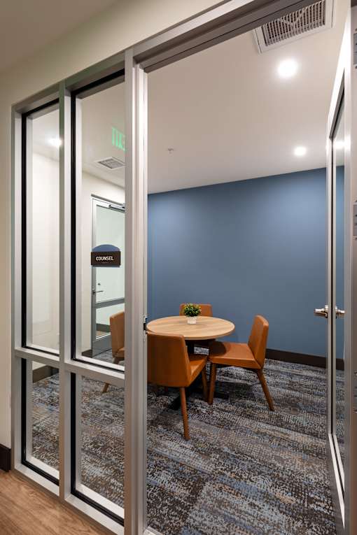 A glass door with a sign that says "EXIT" on it.