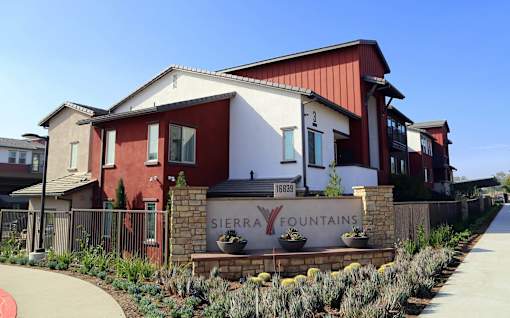 A red and white building with a sign that says Sierra Fountains.