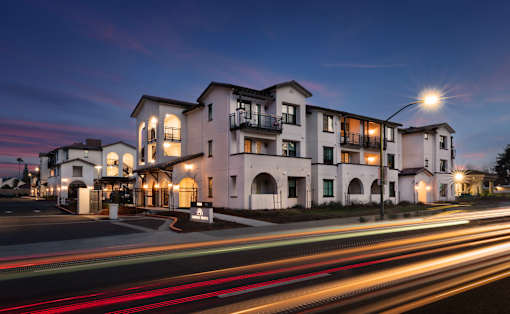 A long exposure shot of a building with a street in front of it.