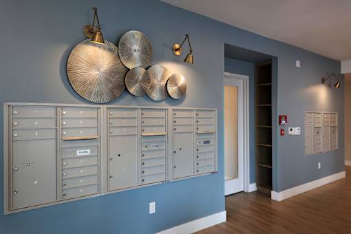 A wall of mailboxes in a hallway.