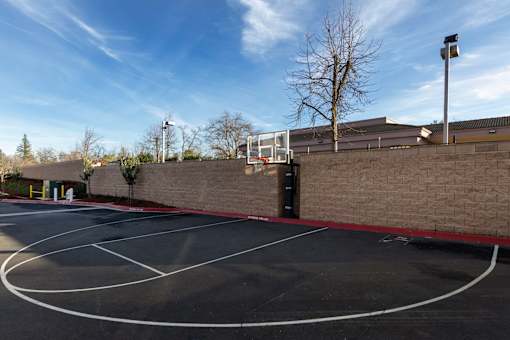 A basketball court with a red line on the ground.