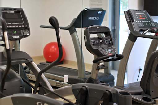 A row of treadmills in a gym.