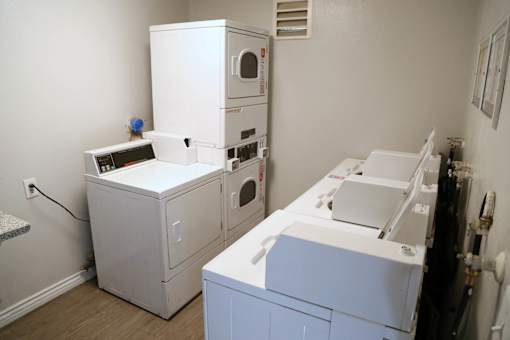 A white oven and microwave are on a counter in a kitchen.