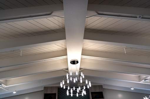 A chandelier with multiple lights hanging from the ceiling.