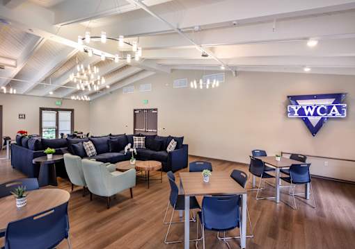 A conference room with a logo on the wall.
