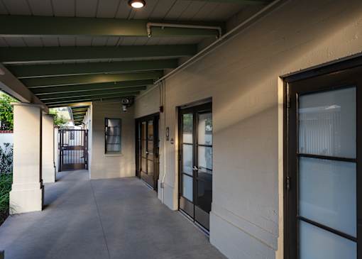 A long hallway with doors on both sides.