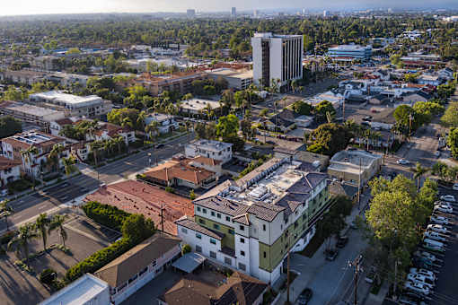 A cityscape with a mix of residential and commercial buildings.