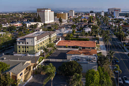 A view of a city with buildings and cars.