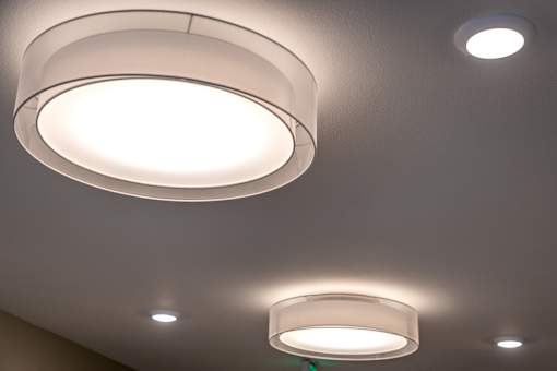 Two ceiling lights are on.