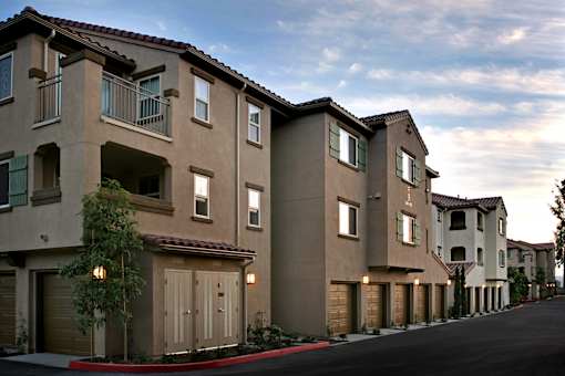 A long row of houses with garages.