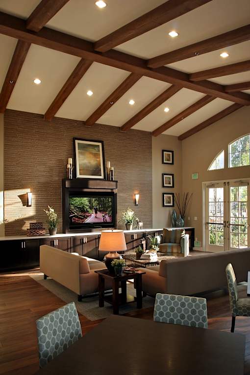 A living room with a flat screen TV and a fireplace.