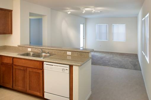 A kitchen with a washer and dryer built in.