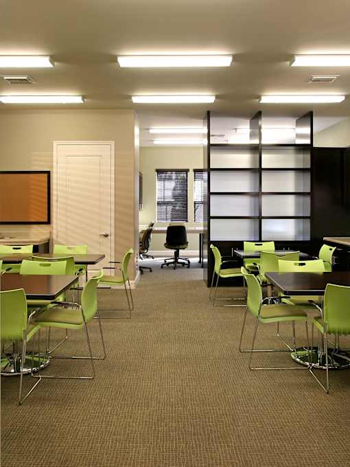 A room with tables and chairs.