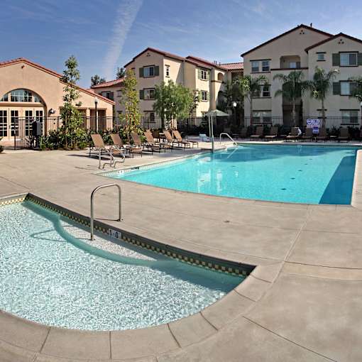 A swimming pool with a ladder in the middle of it.