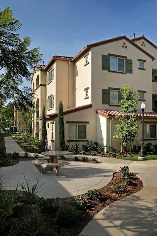 A large building with a courtyard in front of it.