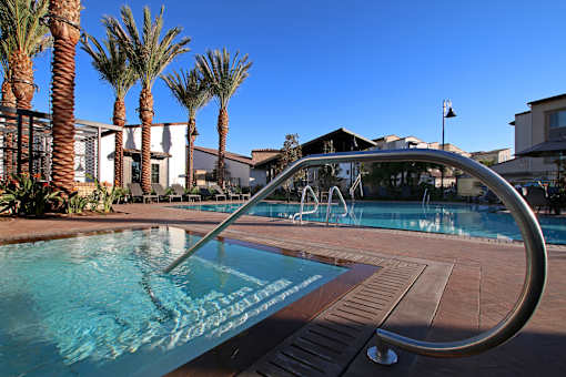 A pool with a slide in the middle of it.