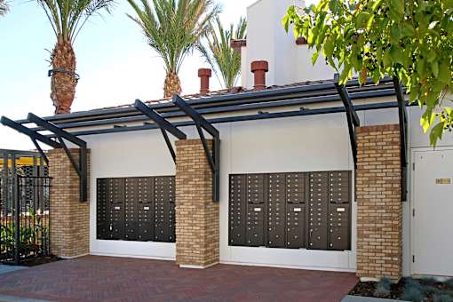 A house with a black gate and a black roof.