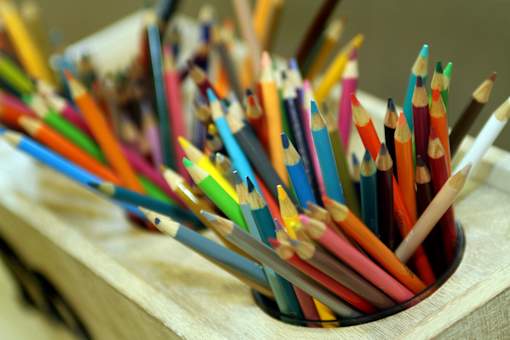 A cup full of colorful pencils.