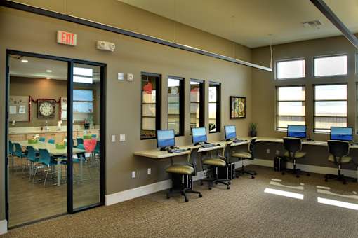 A room with a glass door and a clock on the wall.