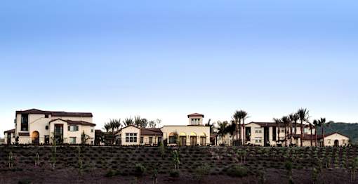 A row of houses on a hillside.