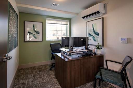 A room with a desk and a chair.