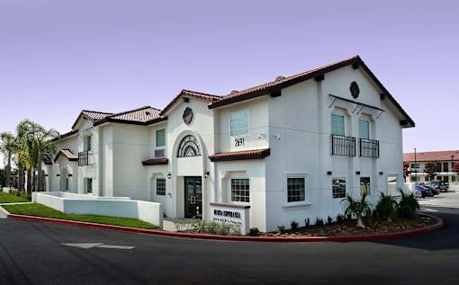 A white building with a red roof and a sign that says "Bonanza.".