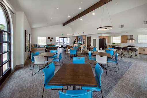 A large room with tables and chairs.
