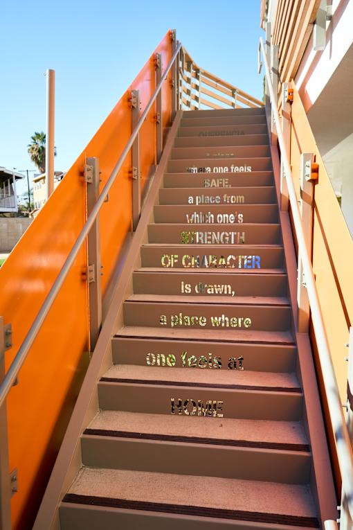 A set of stairs with words written on them.
