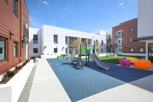 A playground area with a slide and a ball pit.