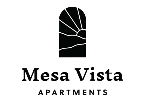 A black and white image of a building with the words Mesa Vista Apartments.