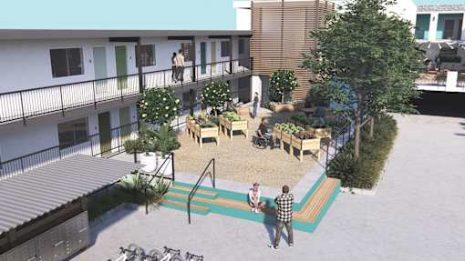 Two people are standing on a balcony.