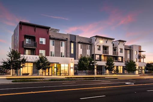 A modern apartment complex with the name "Villa" on the front.