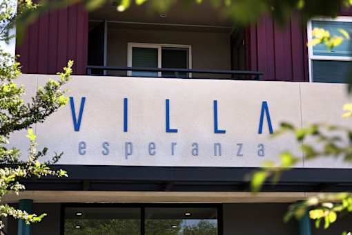A building with a sign that says "VILLA esperanza".