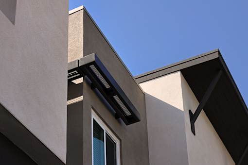 A modern building with a clear blue sky in the background.