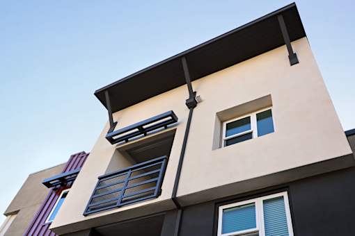 A modern building with a balcony and a window.