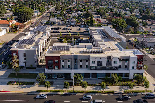 A large building with a parking lot in front of it.