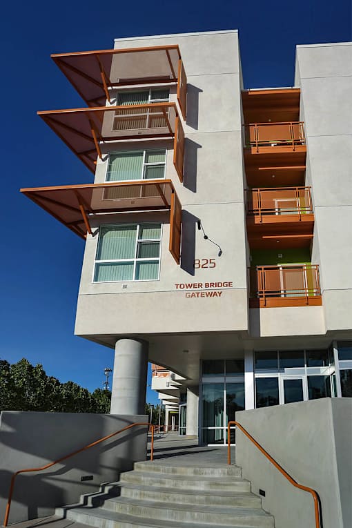 A modern building with a staircase leading to the entrance.