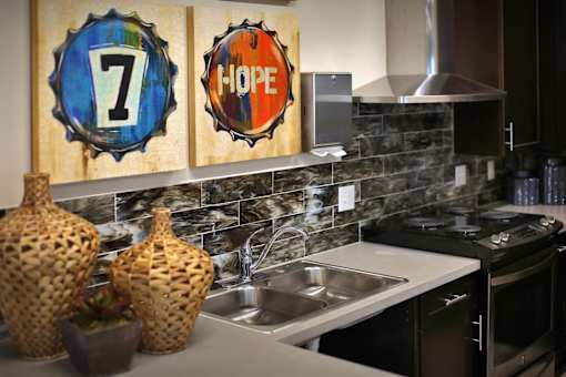 A kitchen with a number 7 on a blue bottle cap and a word HOPE on a red bottle cap.