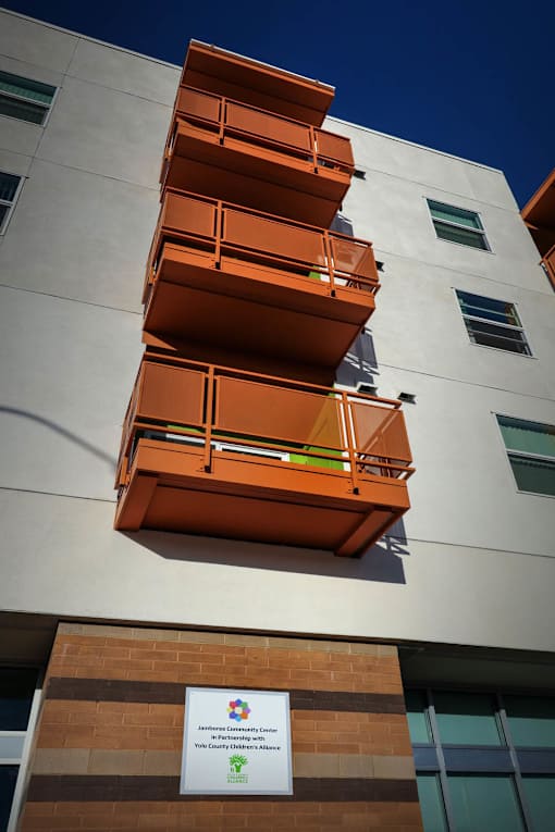 A building with a sign that says "The University of Queensland" on it.