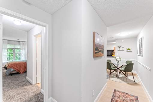 A room with a table and chairs in it.