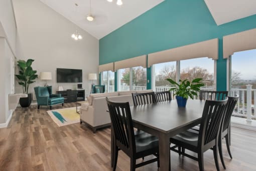 A dining room with a wooden table and chairs. at South Winds Apartments, Fall River, MA