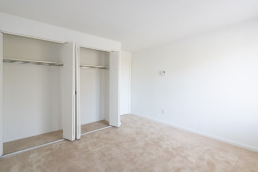 A room with a carpeted floor and white walls. at South Winds Apartments, Massachusetts, 02720