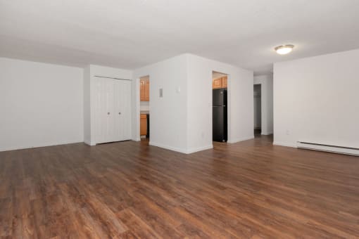 A room with wooden floors and white walls. at South Winds Apartments, Massachusetts