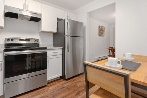A modern kitchen with a stainless steel oven and refrigerator. at South Winds Apartments, Fall River, MA, 02720
