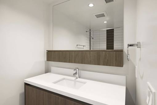 A bathroom sink with a mirror above it. at The View, California, 90005