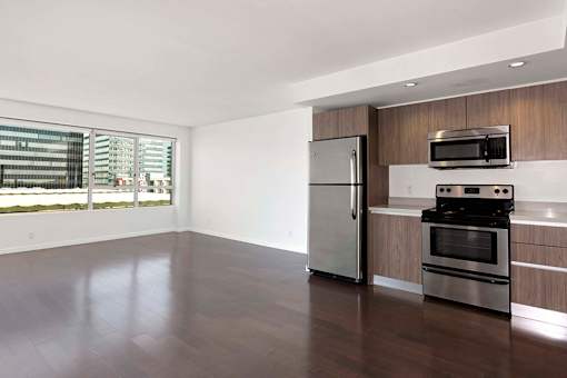 A kitchen with a stainless steel refrigerator and oven. at The View, Los Angeles, 90005