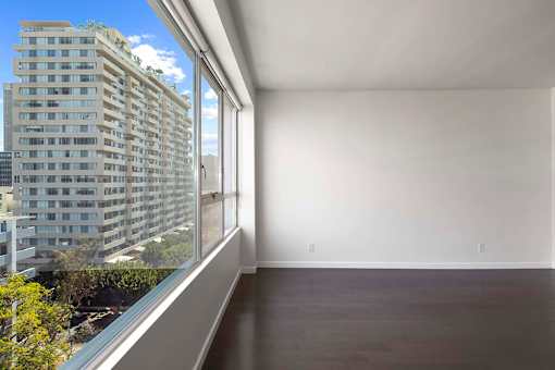 A room with a large window overlooking a cityscape. at The View, California