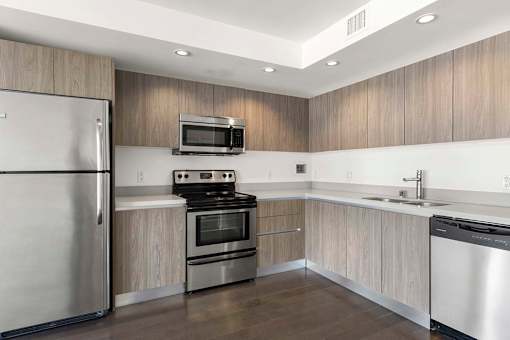 A modern kitchen with stainless steel appliances and wooden cabinets. at The View, California