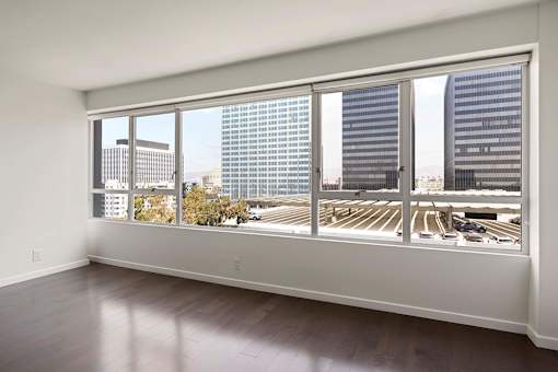 A room with a view of a parking lot and buildings outside. at The View, Los Angeles, California