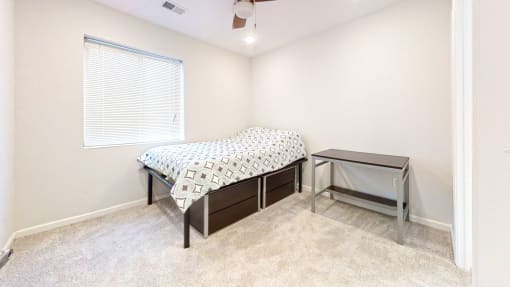 a bedroom with a bed and a nightstand